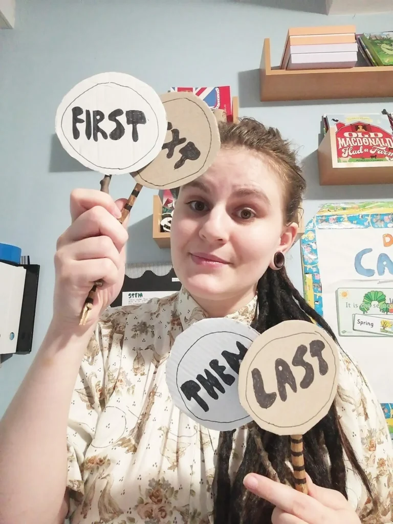 Alice holding some sequential phrases: first, next, then, last. 